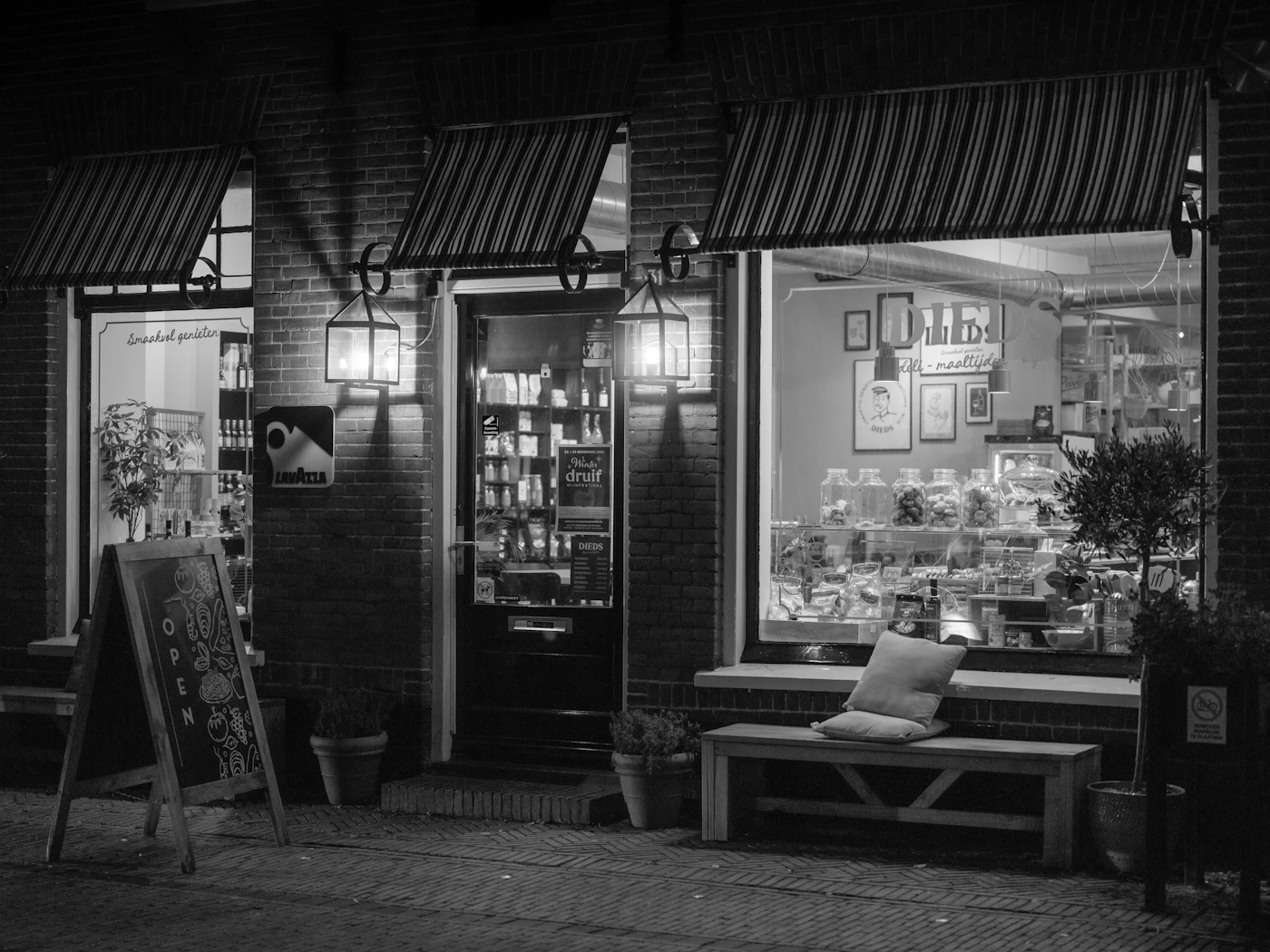 A shopfront lit from inside at night