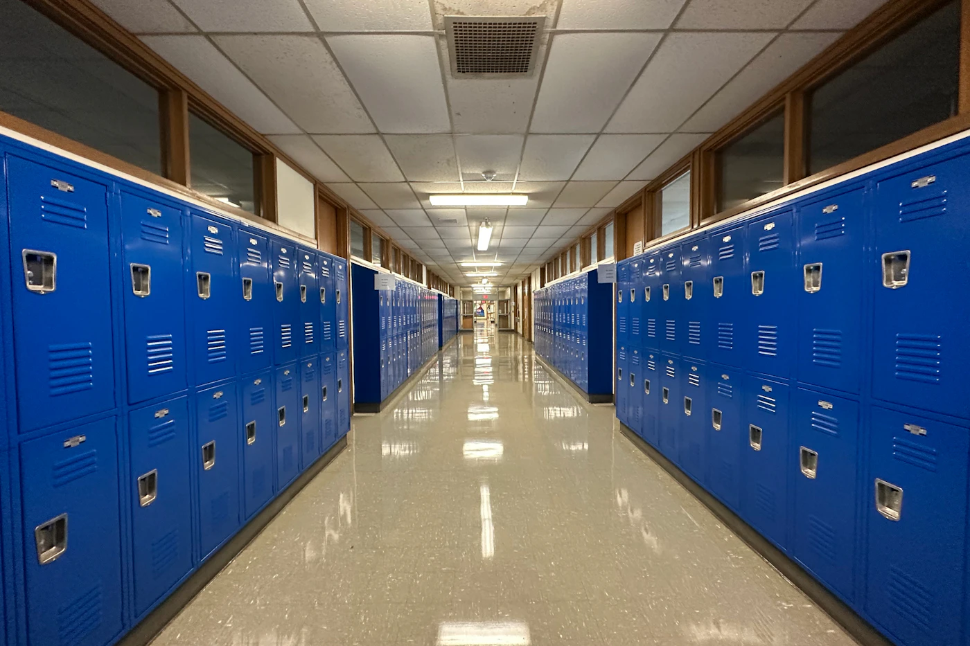 An empty school corridor lined with lockers
